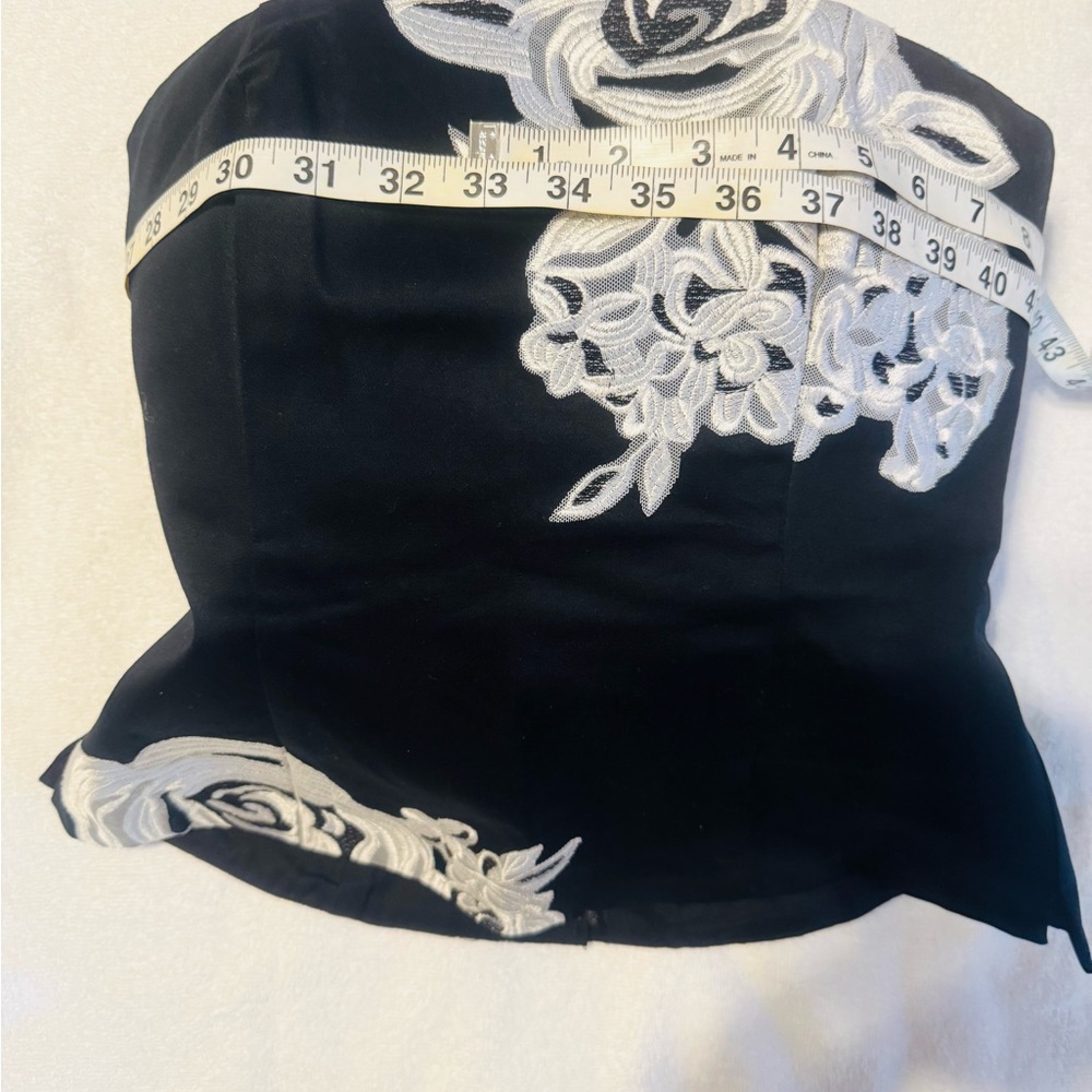 White House Black Market Black Strapless Top with White Floral Appliqué